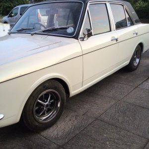 Ford Cortina 1600E Series 2 In White With a Black Vinyl Roof.